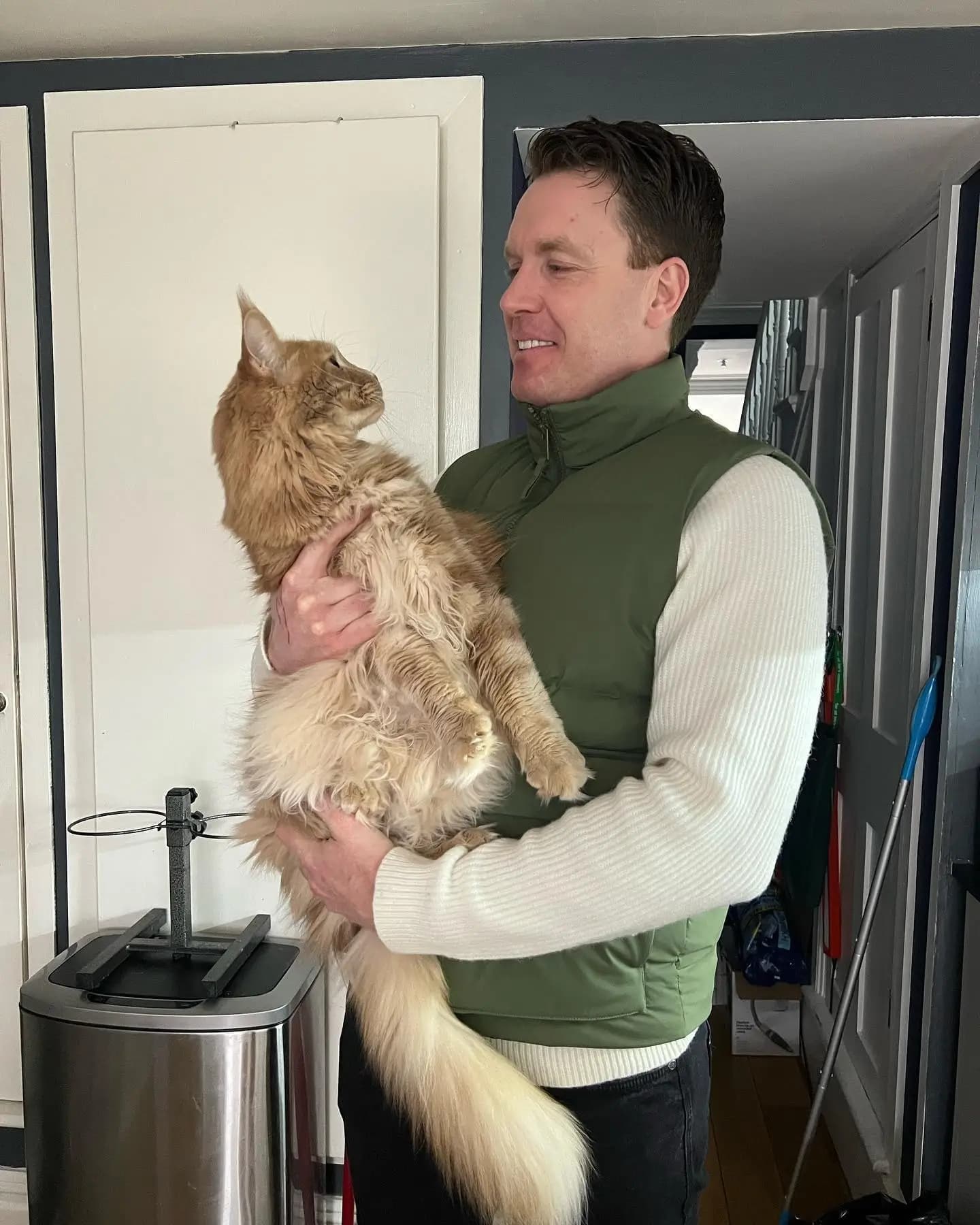 Dr. Tony with a cat in London during a home vet visit