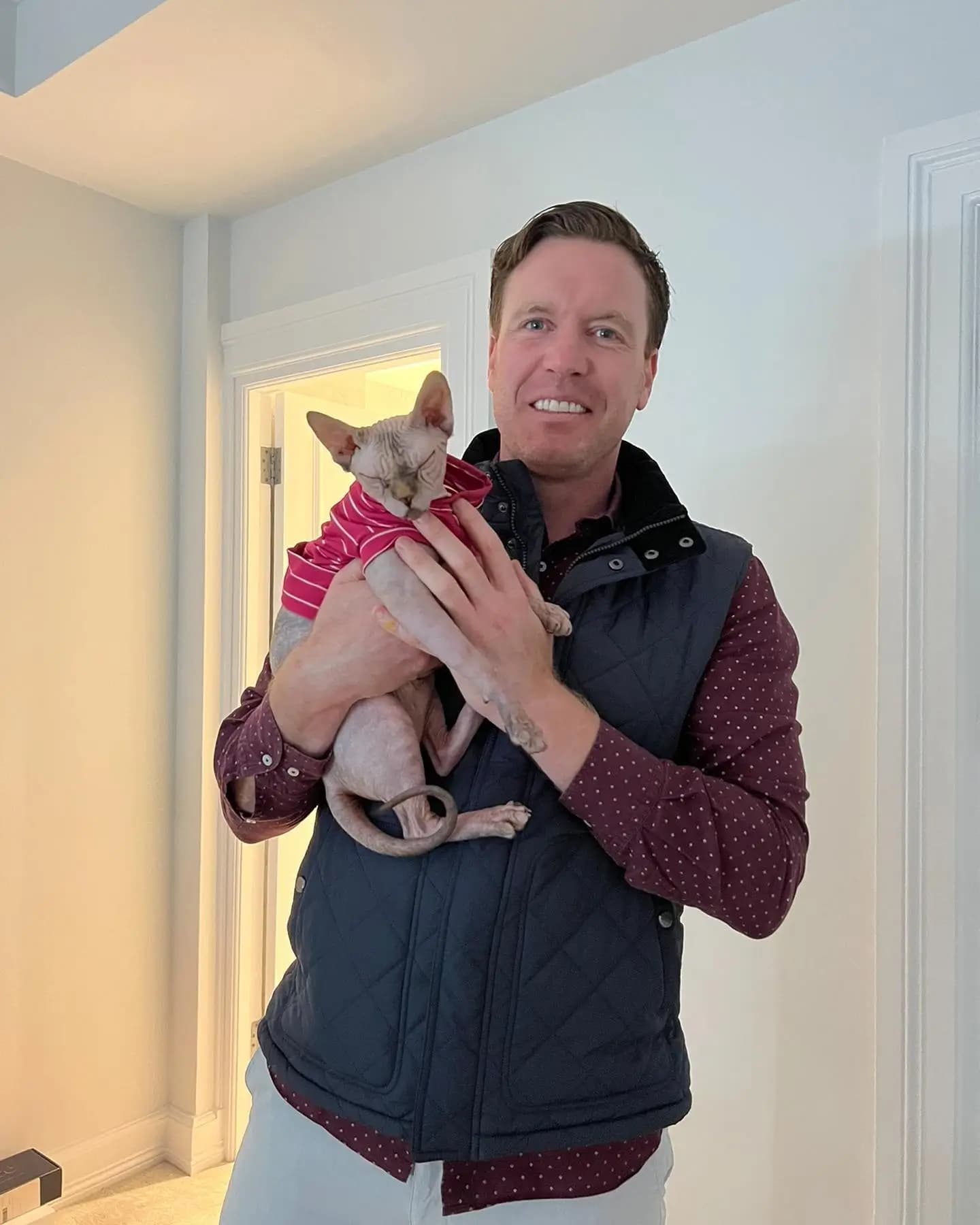 Dr. Tony with a cat in London during a home vet visit