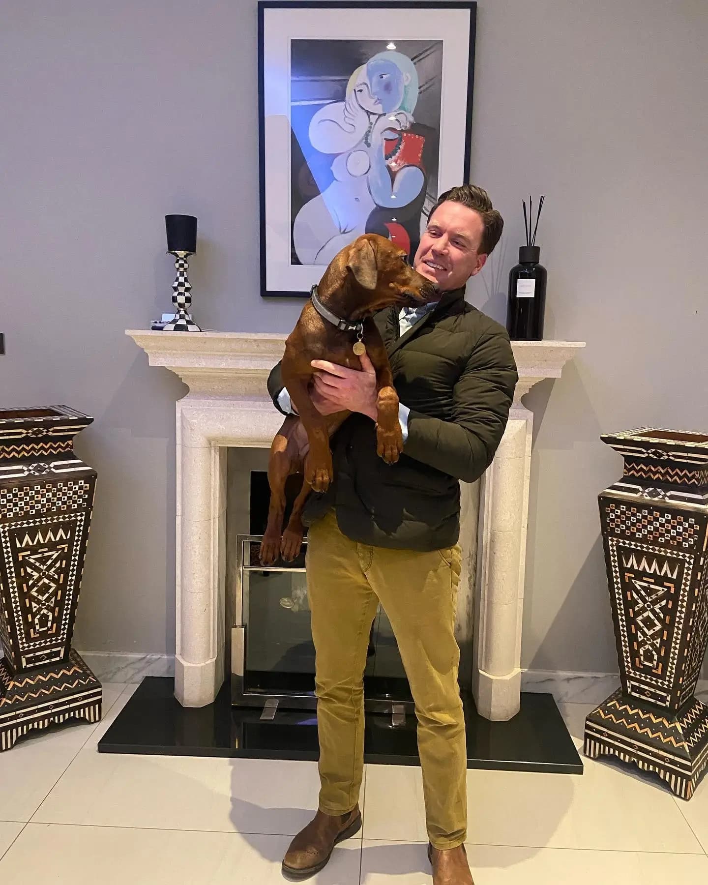 Dr. Tony with a dog in London during a home vet visit