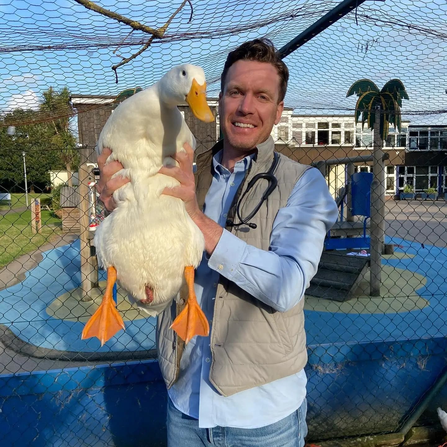 Dr. Tony with a duck in London during a home vet visit