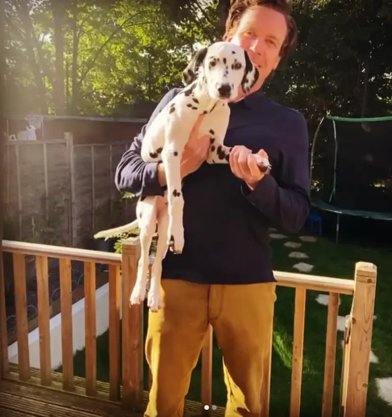 Dr. Tony with a dog in London during a home vet visit
