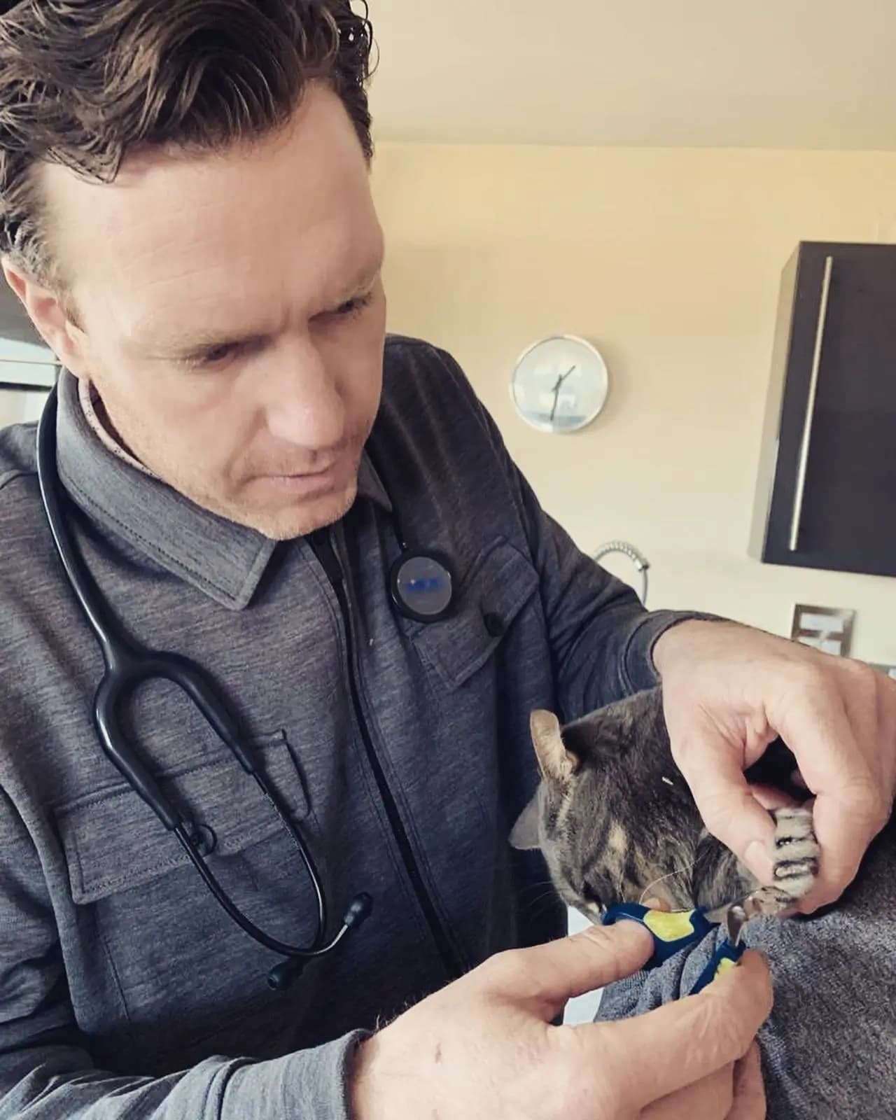 Dr. Tony on a home visit, smiling with one of his patients